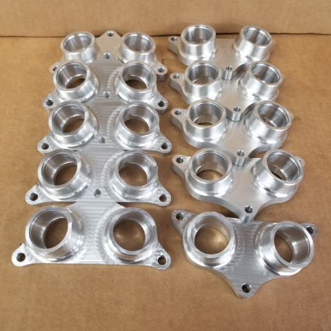 Billet intake manifolds for dual carb Honda XR350.