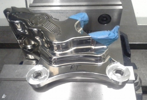 Customizing brake caliper mount for Harley show bike. 